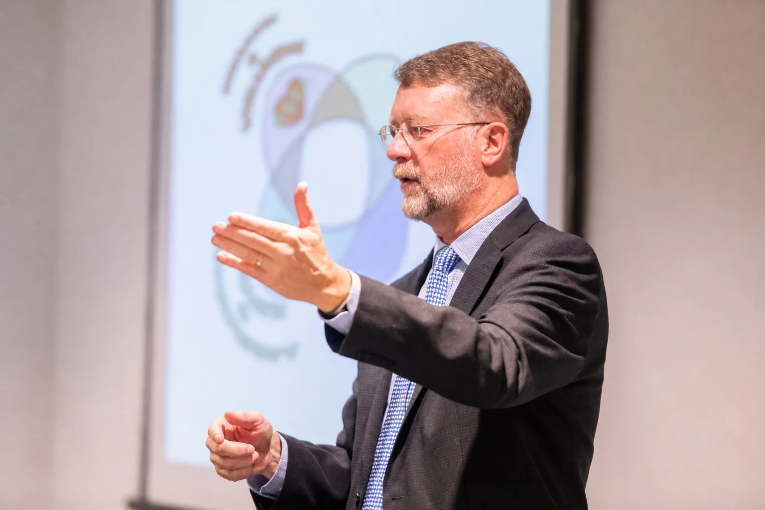 B. Joseph Pine II presenting the four spheres of transformation on stage